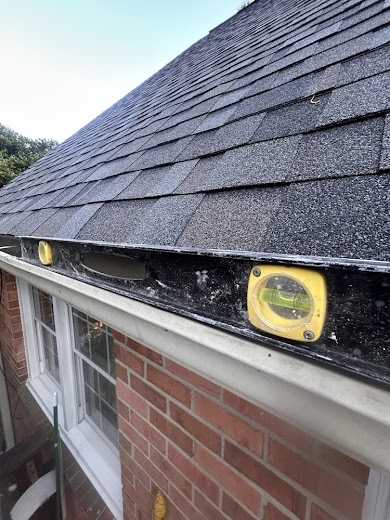 Checking Gutter Pitch with Level